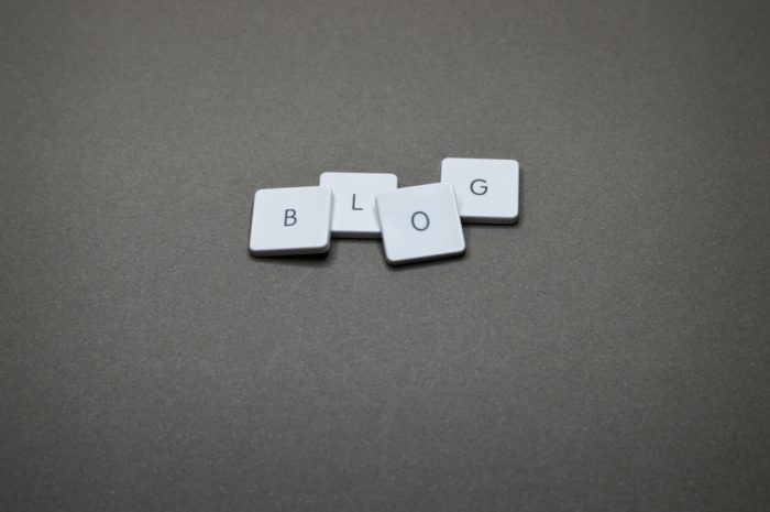 The word "blog" spelled out by Scrabble letter blocks